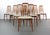 A set of eight rosewood Eva dining chairs designed by Niels Koefoed for Koefoeds Hornlet. Chairs feature a comfortable...