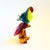 A large vibrantly colored blown art glass parrot.