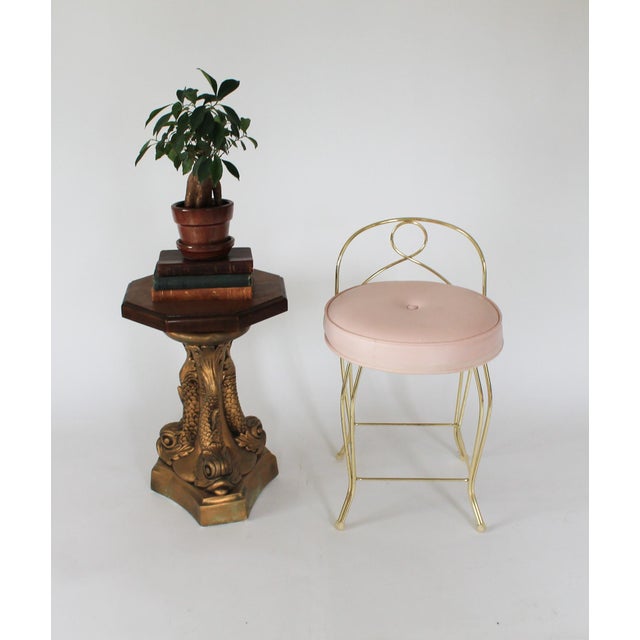 Vintage vanity stool with pale pink vinyl seat and and lacquered metal brass base. Made by George Koch Sons, Inc. Makers...