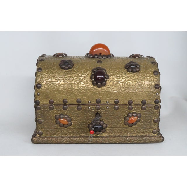 This gorgeous treasure chest / box is made of wood overlaid with brass plating and stone embellishments. A one-of-a-kind...