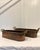 A beautiful pair of vintage copper planter troughs, featuring elongated oval forms with riveted brass loop handles. These...
