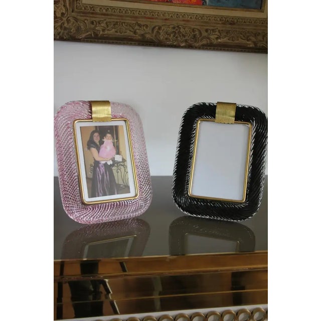 This beautiful vertical photo frame is purely in the Venitian glass manufacturing tradition.The technique uses to get this...