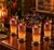 A vintage set of four highball cocktail glasses, with silver ombre finish and embossed design, plus four glass and silver...