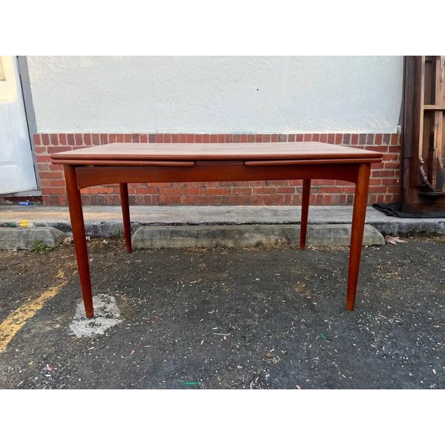 Mid Century Danish Teak Pull Out Dining Table. In the Manner of Ib Kofod Larsen. (1960s) Solid Teak. Frame, , well made...