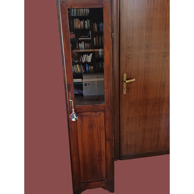 Chestnut wood cabinet with a glass door, a traditional peasant style. In the homes of wealthy farmers in Tuscia and...