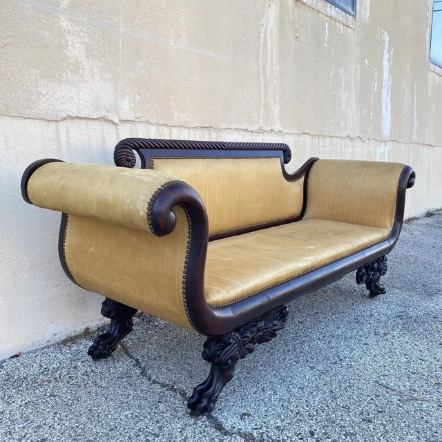 Antique American Empire Classical Carved Mahogany Paw Foot Rolled Arm Sofa. Item features carved paw feet with cornucopia...