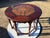 This Vintage English Eight-Legged Inlaid Table is a unique and stylish dining table with a round shape and a bohemian...
