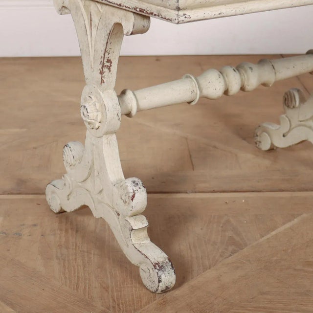 19th Century painted Italian stool with needle work upholstery that possibly needs replacing. 1890. This piece is designed...