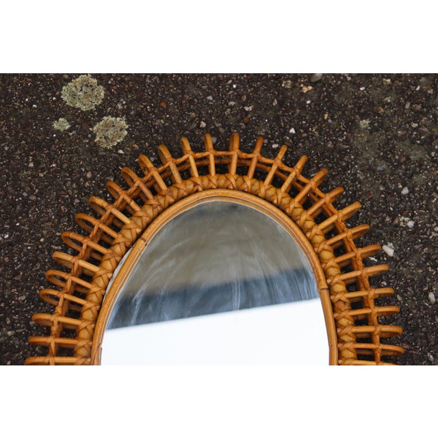 Pair of rattan mirrors by Franco Albini. Originating from Italy, and made in the 1950s/60s. These mirrors are sure to...