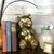 Charming panda statue constructed of warm, shiny brass. Panda is sitting and eating and looks so darn cute. Statue is...