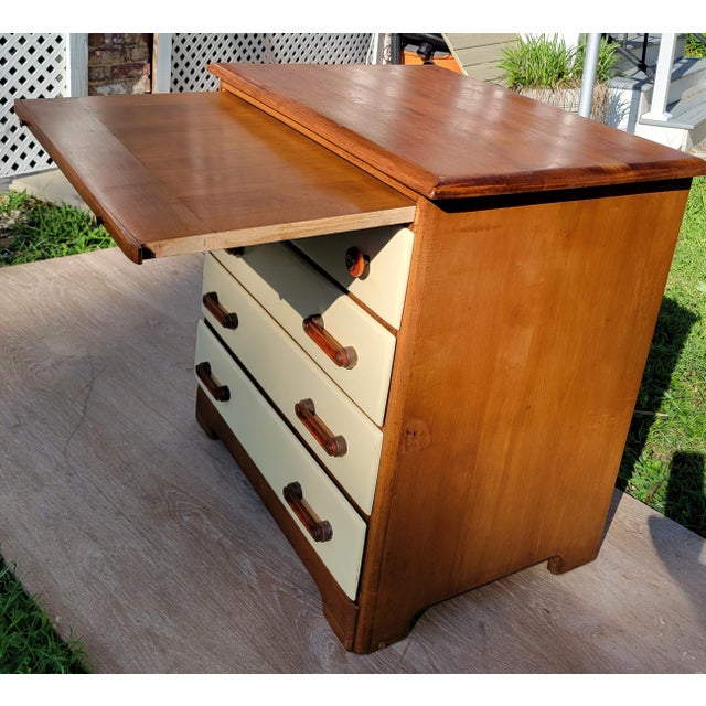 This perfectly sized, one-of-a-kind four-drawer dresser features a 13-inch deep pullout to accommodate a laptop or other...