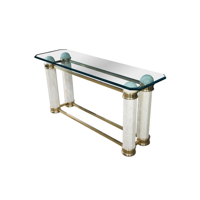 A stately Italian Regency Console or Sofa Table, circa 1980s. Features a beveled glass top with canted corners supported...