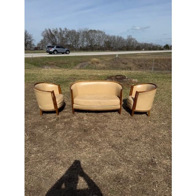 Classic French Art Deco Solid Mahogany Barrel Back Club Chairs and settees. The wood has been finished with a lustrous...
