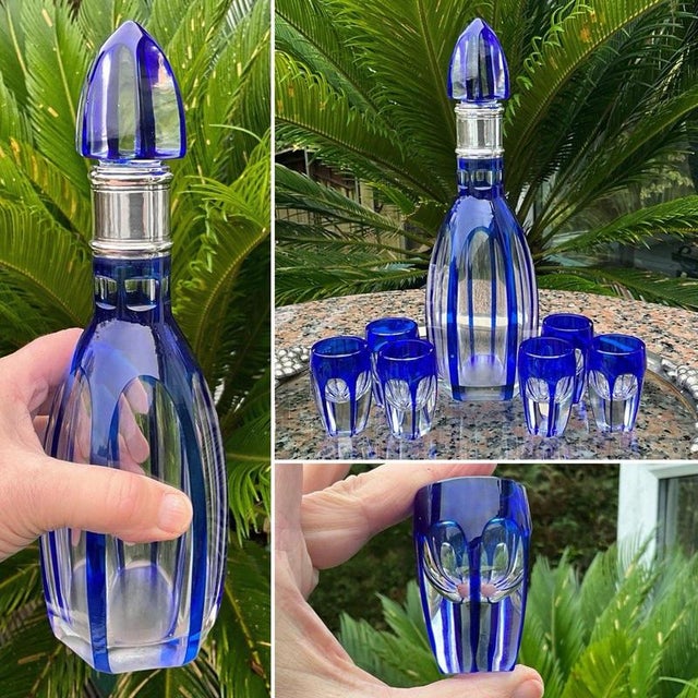 An exceptional early 20th-century French Baccarat crystal liqueur service comprising a cobalt blue cut-to-clear decanter...