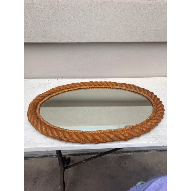 Large oval rope mirror Audoux Minet, circa 1960 from South of France. 24 inches H / 17.5 inches W