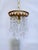 This is an Italian brass rim chandelier dressed with octagon chain and U-drop cut crystals drops. It has 1 Edison base...