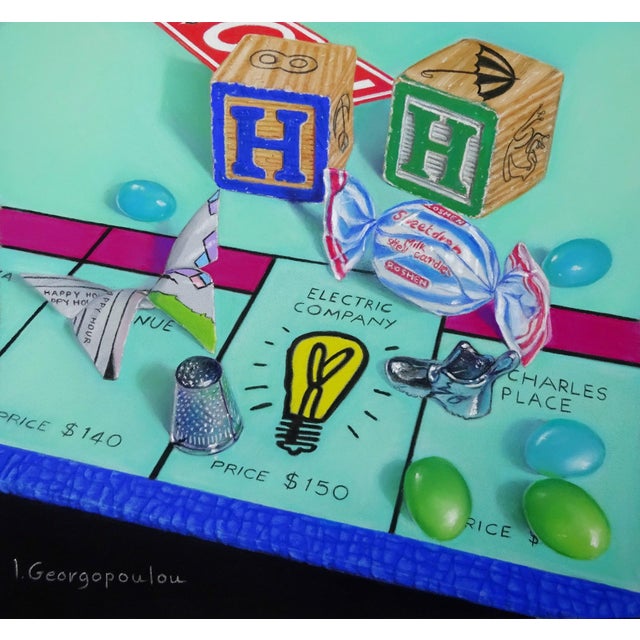 Happy Hour features a playful arrangement of objects inspired by the classic game of Monopoly, including colorful building...