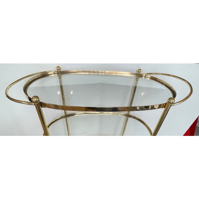 This is a wonderful and very elegant Italian Brass 3 Tier Bar Cart, with Glass Shelves. This is a heavy cart on casters....