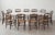 Set of Ten Hitchcock Ebonized Ladderback Dining Chairs With Rush Seats, 19th Century For Sale - Image 6 of 7