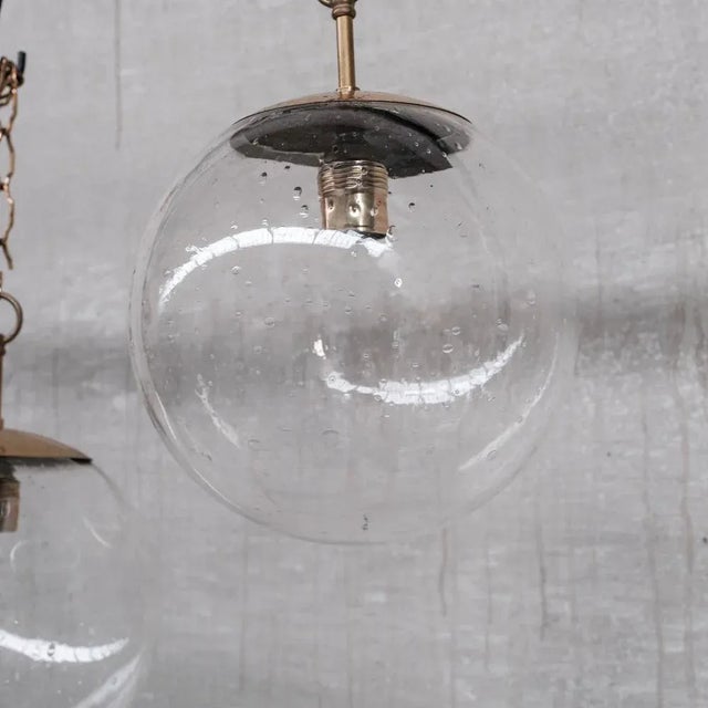 Mid-Century Brass and Bubble Glass Pendant, in Good conditions. Designed 1960 to 1969 UK Plug (up to 250V).The wiring of...