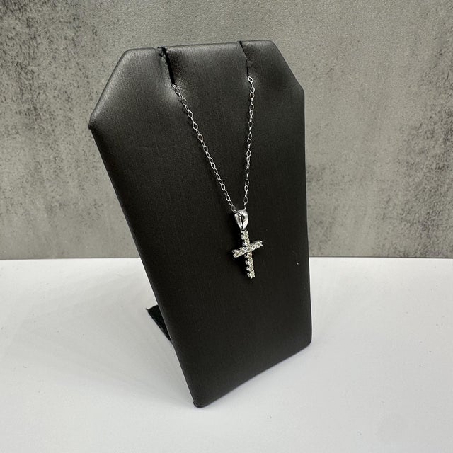 This elegant natural diamond cross necklace in 14kt white gold features 0.20 carats total weight of HI SI round diamonds,...