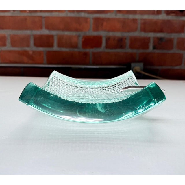 Sleek and sculptural ashtray by California-based studio artist Stephen Schlanser, known for his bold, minimalist forms in...