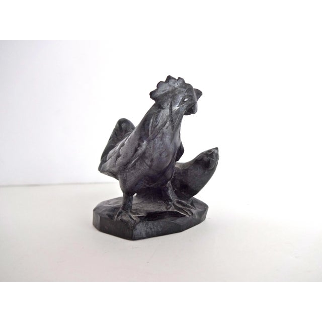 An antique figurine of a rooster and chicken, carved in fine detail from black soapstone. A little under 2" high by 1 3/4"...
