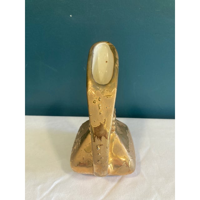This vintage gold ceramic pitcher is a stunning sculptural piece with an abstract, modernist silhouette. Its angular...