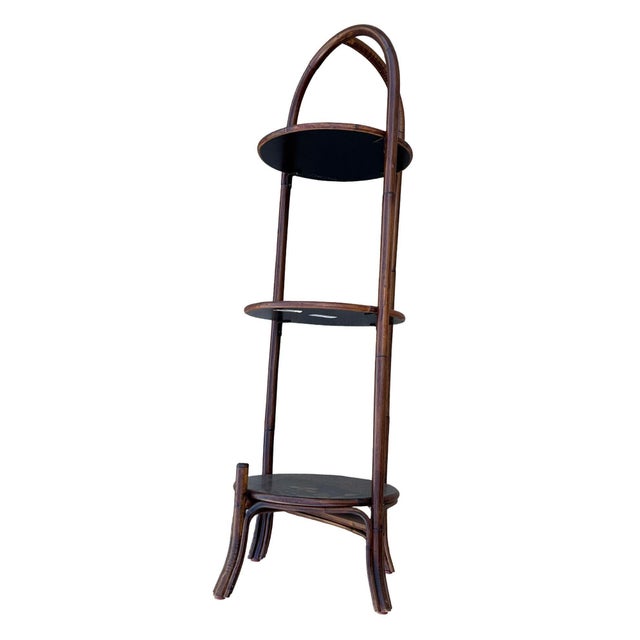 Tropical-inspired three-tiered shelf features a 12-inch height between the two bottom shelves, offering ample space for...