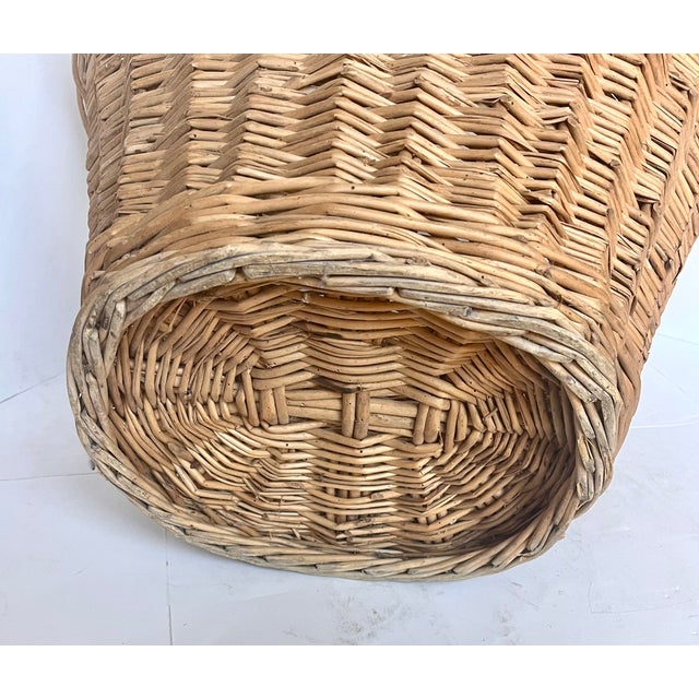 Imported from France. Vintage European oval wicker market basket with interlocked braided edge and twisted handles. Very...