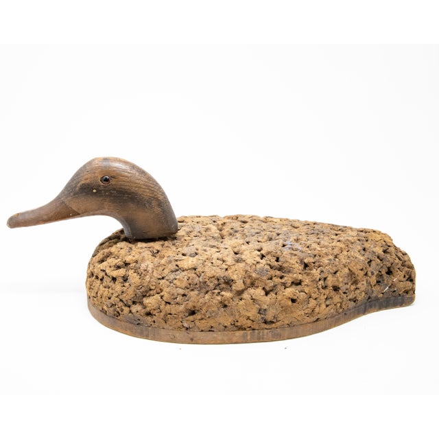 Offering this neat little Duck Decoy with a cork body and removable wooden head. Interesting texture to the body from age...