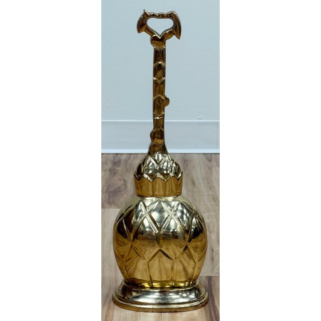 Very large vintage brass pineapple doorstop. Features wonderful detail and convenient long handle. A truly stunning...