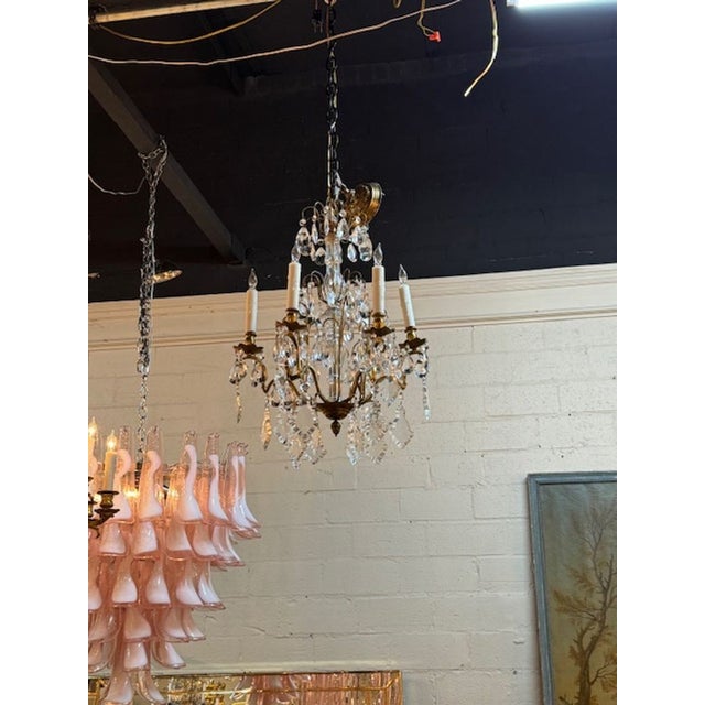 Beautiful petite French bronze and crystal chandelier. A sparkling beauty for a small space! This fixture is wired and...