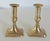 Smaller pair of English Georgian cast brass candlesticks with push-up bases. Rectangular form bases feature parallel line...