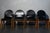 Set of four chairs attributed to Afra and Tobia Scarpa, in larch and original black vinyl, filled over the years as shown...