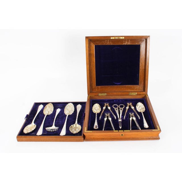 This is a beautiful antique Victorian burr walnut boxed twelve piece silver plated dessert service with maker marks for...