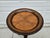 This beautiful round barley twist side table has a fixed tray top design with stylized palm leaves on the tabletop. The...
