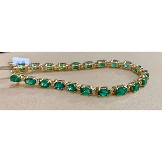 This exceptionally affordable Tennis bracelet has 21 stones of oval Emeralds . Each Emerald is spaced by a tiny diamond ....