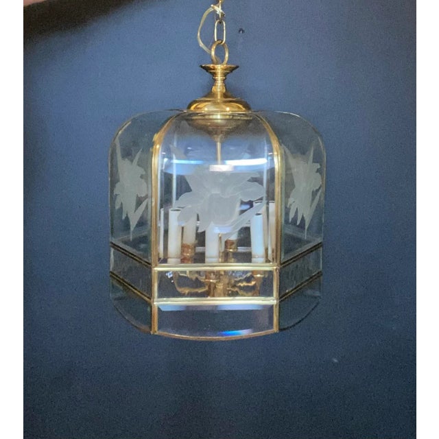 Hexagon shaped lucite panels with cascading waterfall edge top. Etching of six Irises around perimeter with six interior...