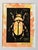 An original hand-carved block linocut featuring a detailed beetle motif, individually printed with black ink and finished...