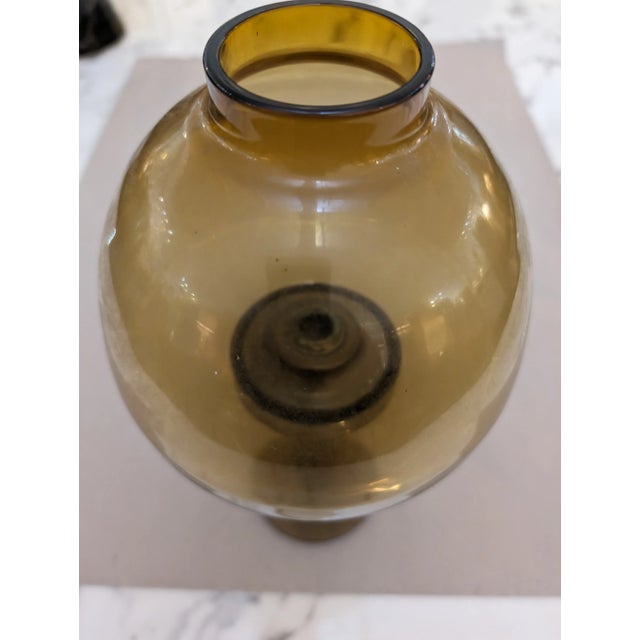 Hans Agne Jakobsson hurricane candle holder model no. L102/32. The hurricane is made of solid brass with a mouth blown...