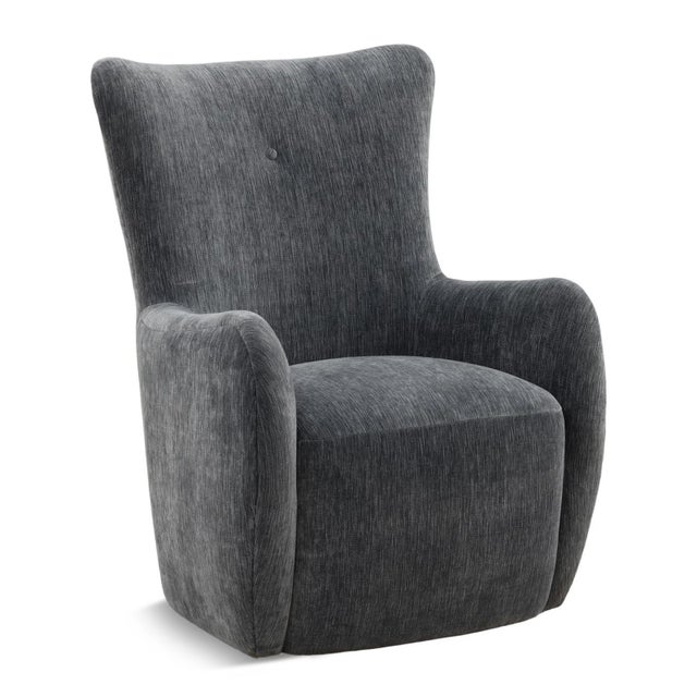 Cool slate blue-grey velvet accent chair with a softly textured finish and a tailored silhouette. This modern wingback...