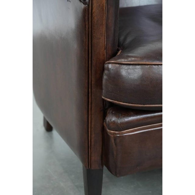 Stylish and Characterful Dark Brown Vintage Club Armchair in English Style Made of Sheepskin with Matching Piping For Sale - Image 11 of 16