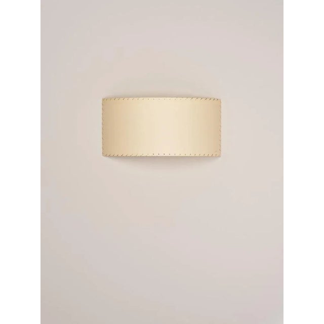 Beige comodín rectangular wall lamp by santa & cole dimensions: d 50 x w 13 x h 24 cm materials: metal, stitched...
