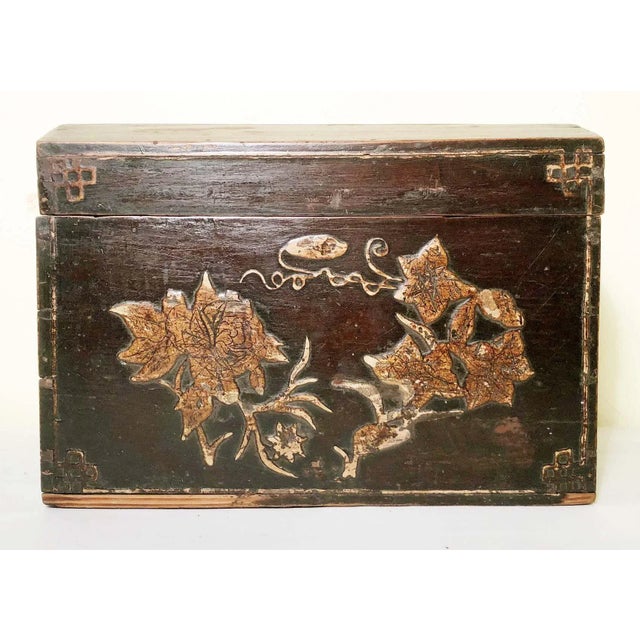 This Antique Chinese Box is hand-painted with a traditional Chinese floral design. The boxes are handcrafted and...
