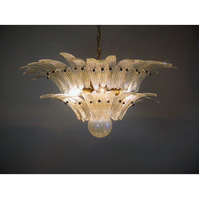 Luxury and genuine murano glass chandelier. Hand made in murano. It made by 58 murano crystal glasses in a gold metal...