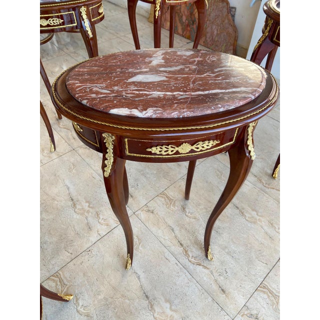 Only one pair available. Elevate your interior with this magnificent pair of French Louis XV side tables, handcrafted from...