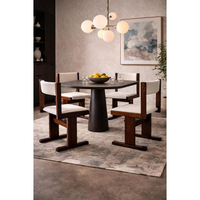 This stunning dining chair is not merely a piece of furniture; it is a captivating embodiment of the golden age of Danish...