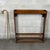 A distinctive and functional solid wood display stand, ideal for storing and displaying collectible walking sticks,...