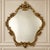 Elevate your interior with this elegant French Rococo-inspired wall mirror, featuring a beautifully sculpted silhouette...